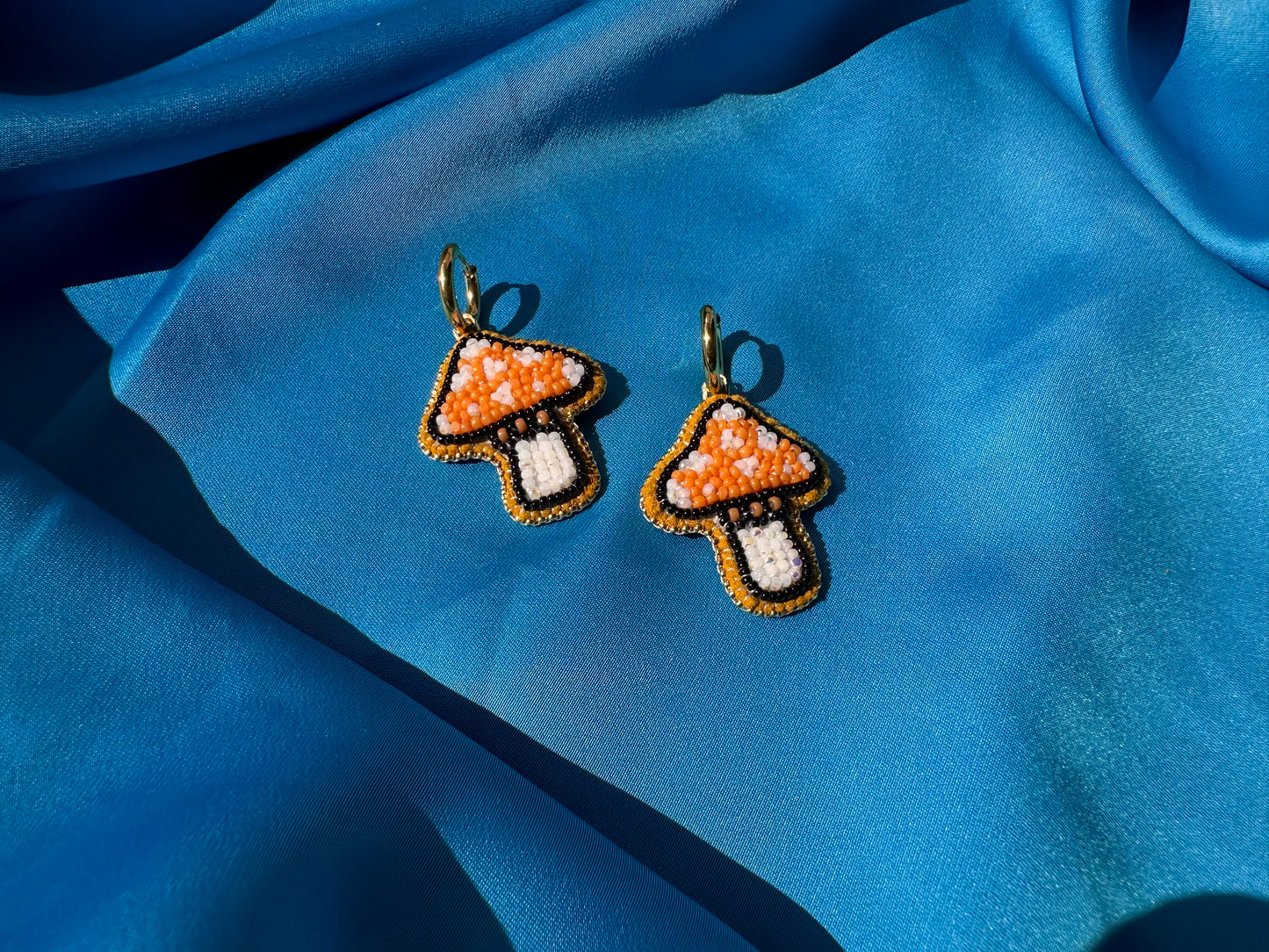 mushroom earrings in orange & white