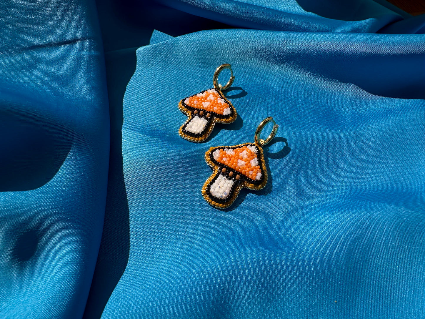 mushroom earrings in orange & white