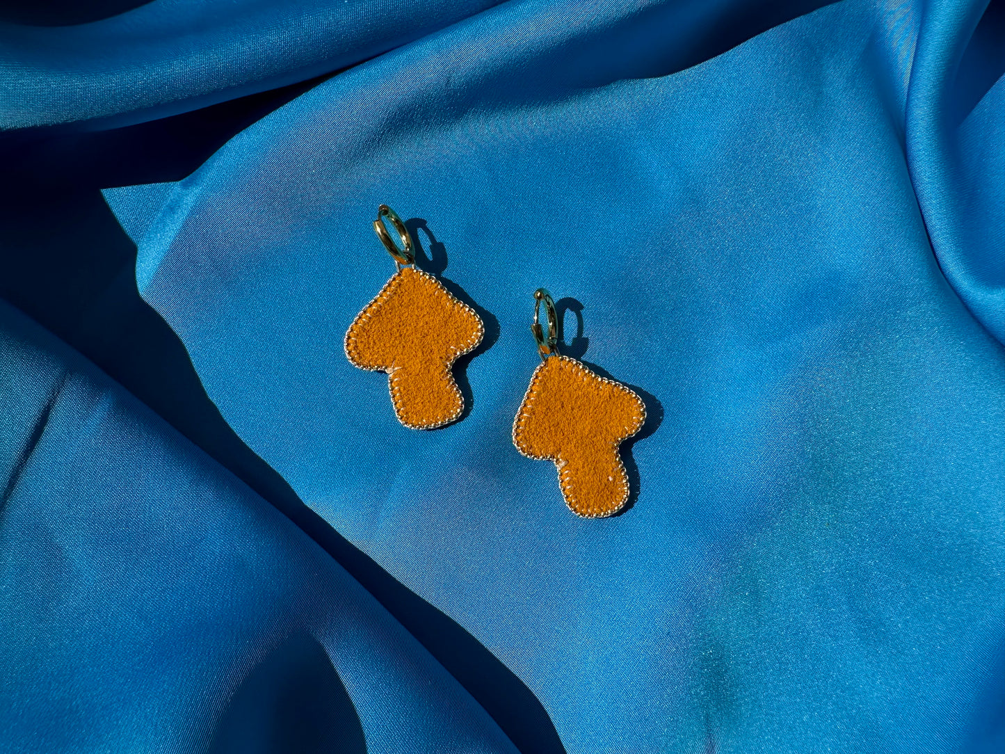 mushroom earrings in orange & white