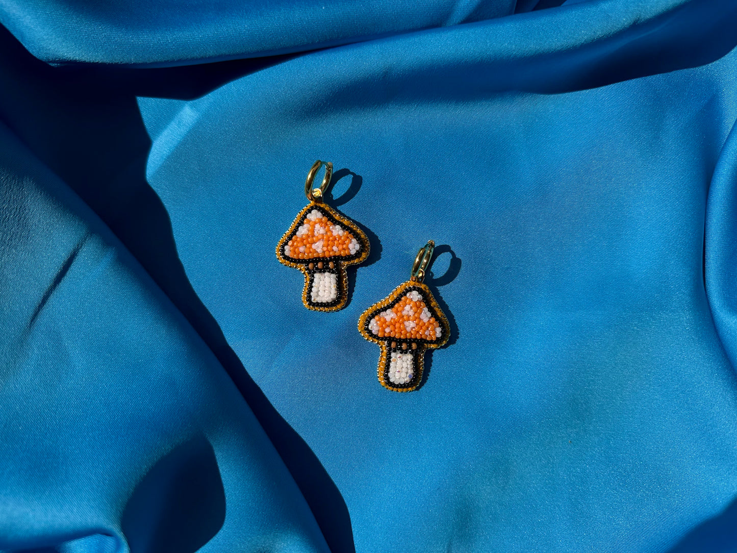 mushroom earrings in orange & white