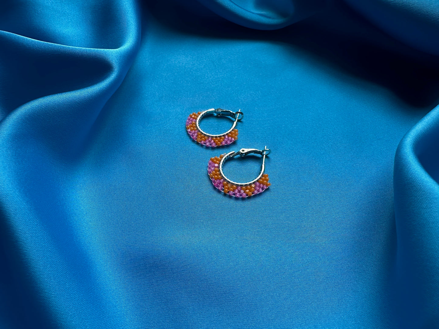 mini beaded hoops in orange & pink