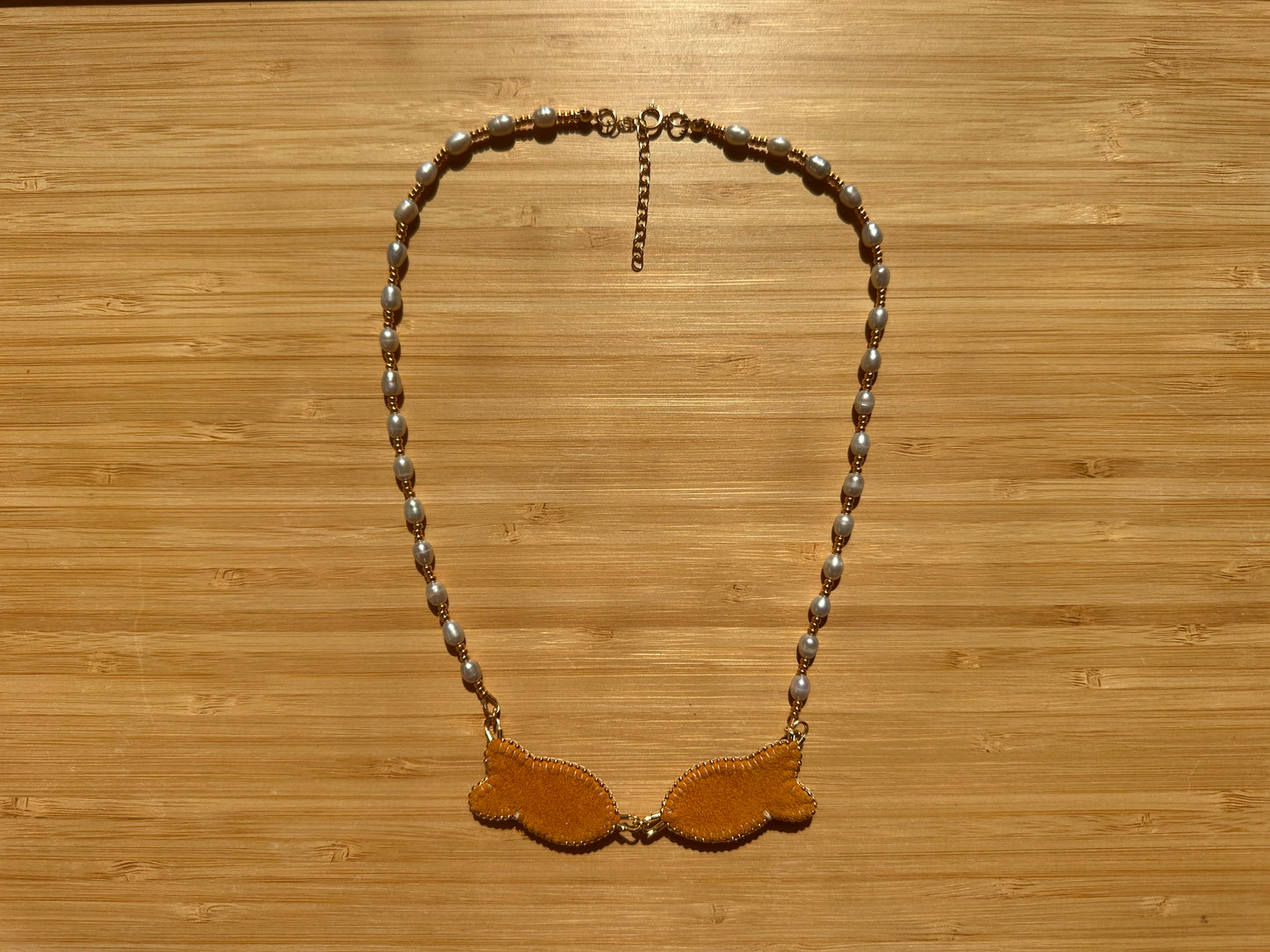 kissing fish necklace