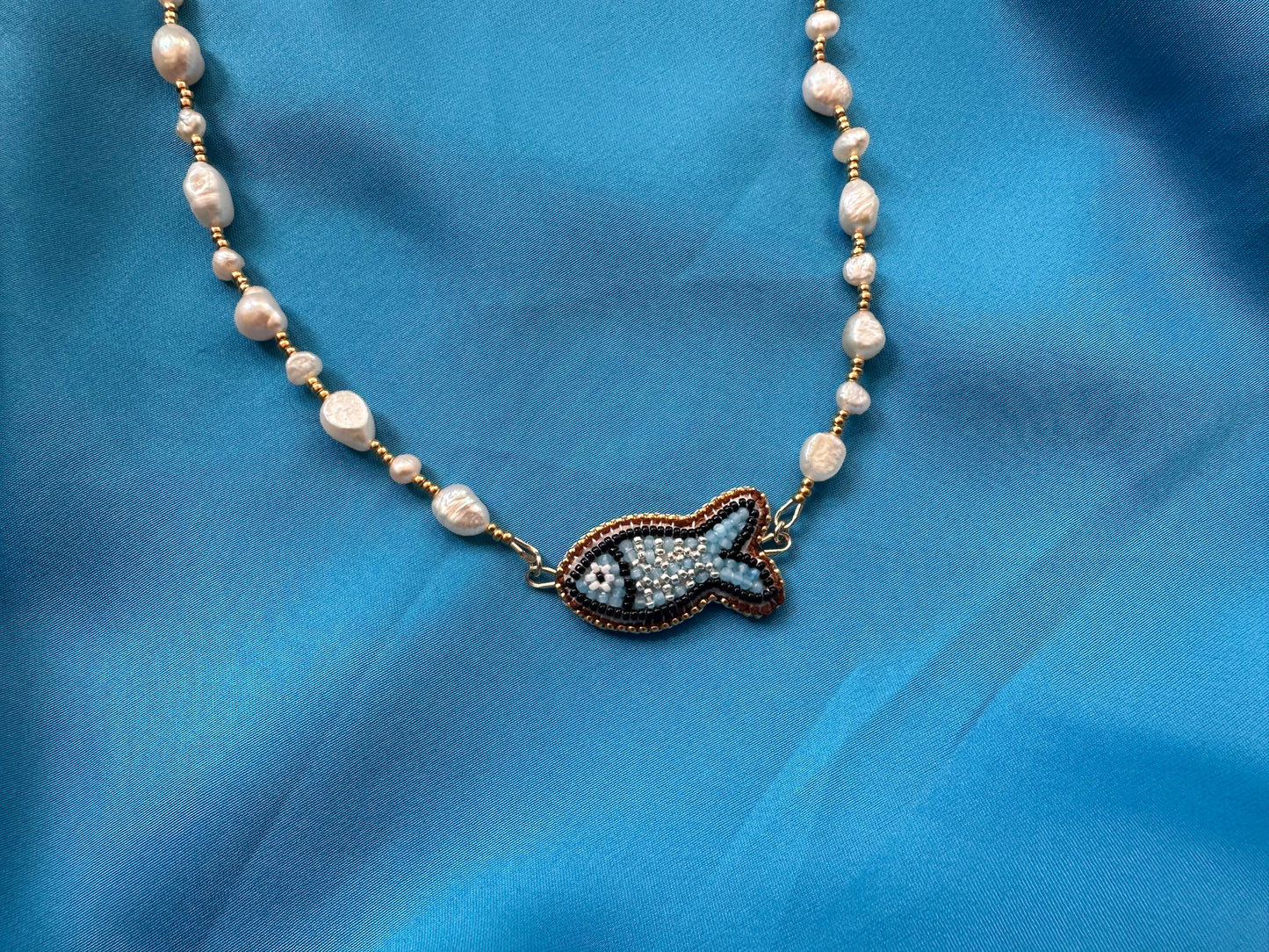 light blue fish necklace