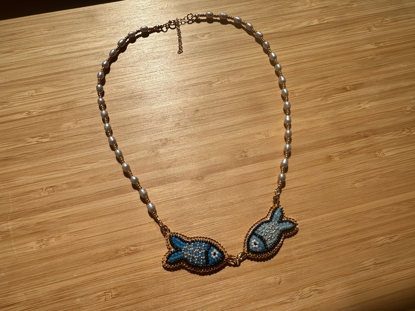 kissing fish necklace