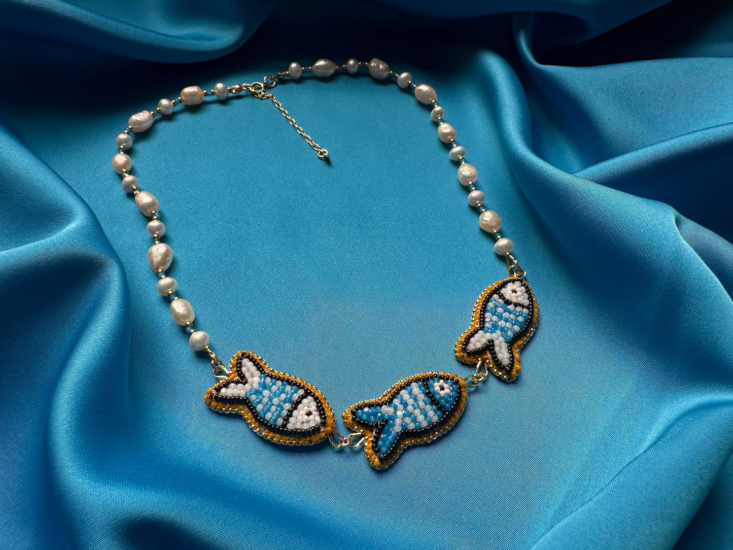 triple fish necklace