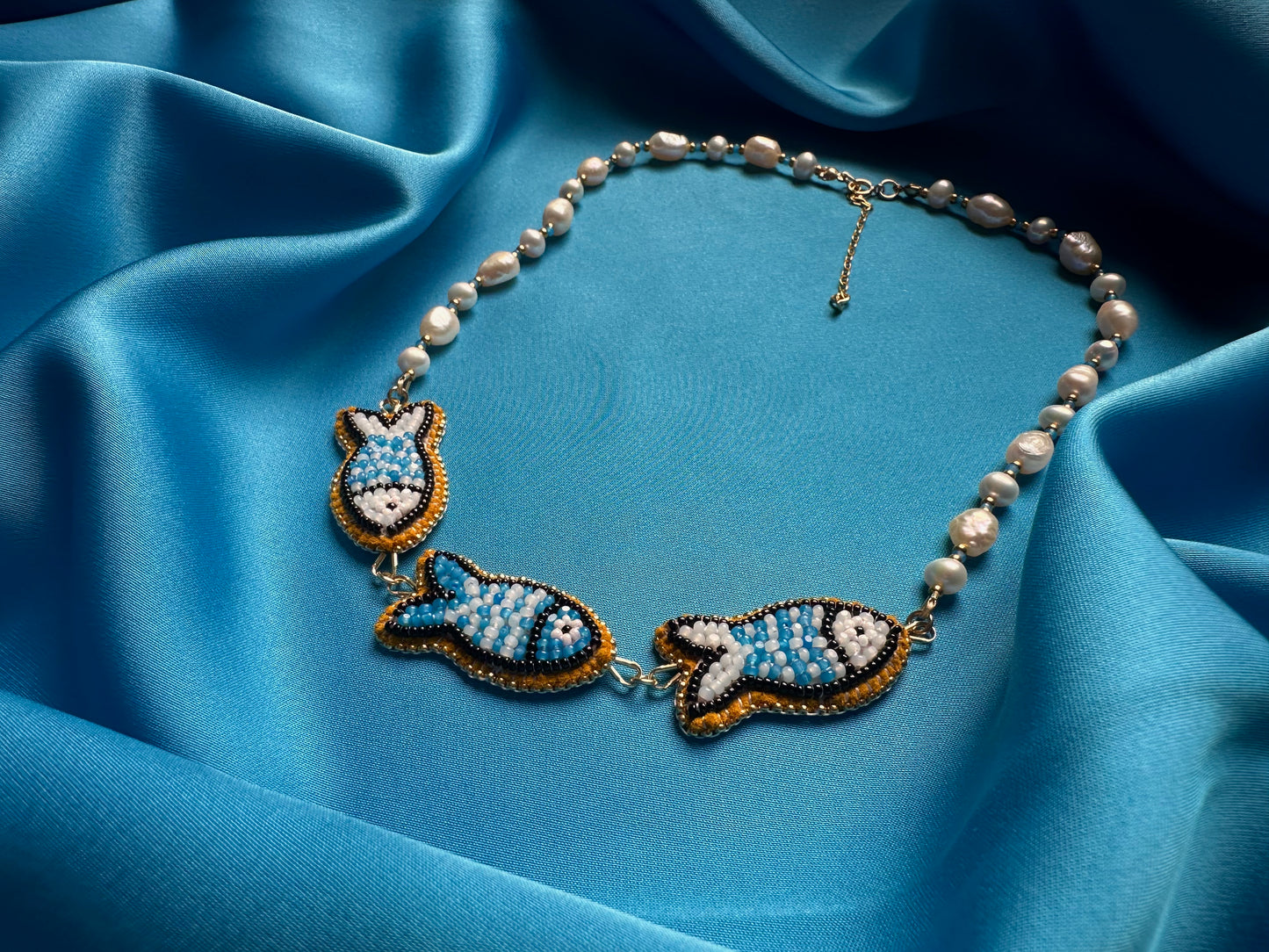 triple fish necklace